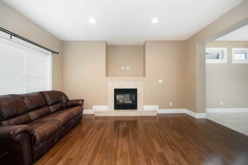 197 Snowy Owl Way Nw, Fort Mcmurray, AB - Indoor Photo Showing Living Room With Fireplace