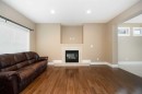 197 Snowy Owl Way Nw, Fort Mcmurray, AB  - Indoor Photo Showing Living Room With Fireplace 