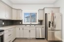 104 Collicott Drive, Fort Mcmurray, AB  - Indoor Photo Showing Kitchen With Stainless Steel Kitchen With Double Sink 