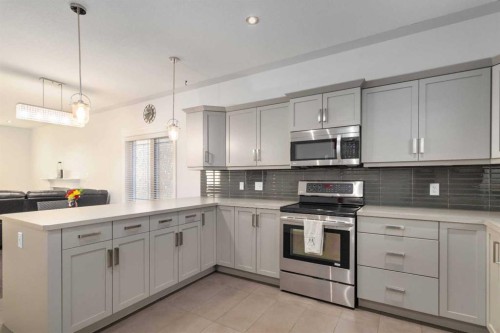104 Collicott Drive, Fort Mcmurray, AB - Indoor Photo Showing Kitchen With Upgraded Kitchen