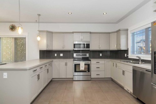 104 Collicott Drive, Fort Mcmurray, AB - Indoor Photo Showing Kitchen With Stainless Steel Kitchen With Double Sink