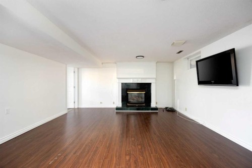 105 Farrell Cove, Fort Mcmurray, AB - Indoor Photo Showing Living Room With Fireplace
