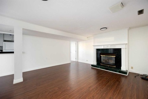 105 Farrell Cove, Fort Mcmurray, AB - Indoor Photo Showing Living Room With Fireplace