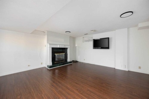 105 Farrell Cove, Fort Mcmurray, AB - Indoor Photo Showing Living Room With Fireplace