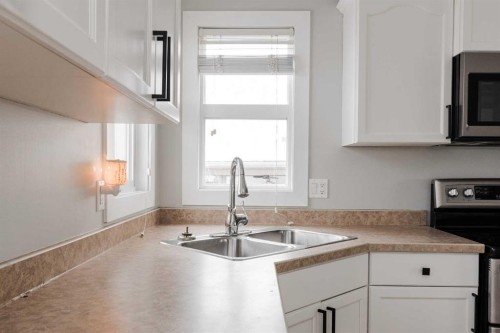 217 Archibald Close, Fort Mcmurray, AB - Indoor Photo Showing Kitchen With Double Sink