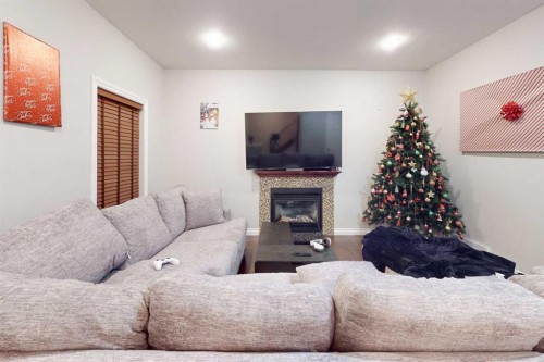 161 Coniker Crescent, Fort Mcmurray, AB - Indoor Photo Showing Bedroom With Fireplace