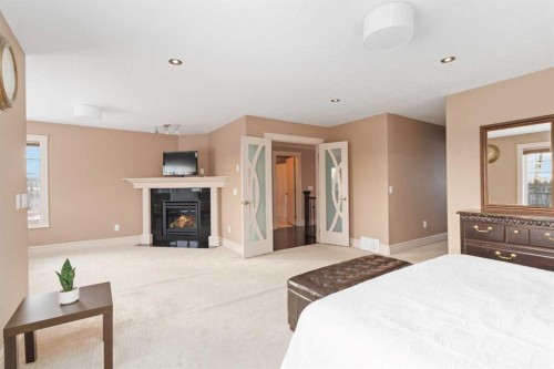 131 Falcon Green, Fort Mcmurray, AB - Indoor Photo Showing Bedroom With Fireplace