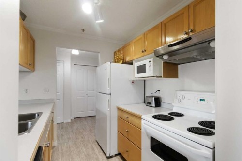 220-100 Richard Street, Fort Mcmurray, AB - Indoor Photo Showing Kitchen With Double Sink