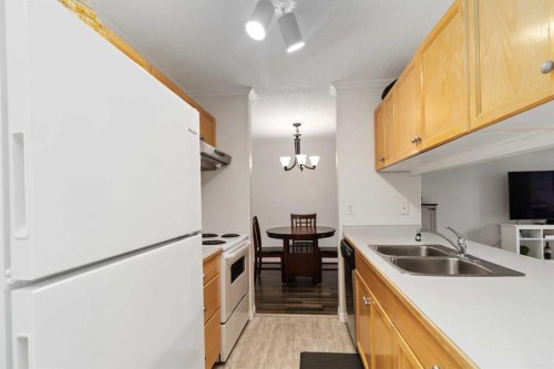 220-100 Richard Street, Fort Mcmurray, AB - Indoor Photo Showing Kitchen With Double Sink