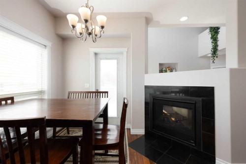 121 Gravelstone Way, Fort Mcmurray, AB - Indoor Photo Showing Dining Room With Fireplace