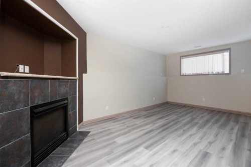 153 Leitner Gate, Fort Mcmurray, AB - Indoor Photo Showing Other Room With Fireplace
