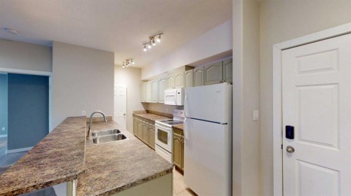 304-290 Plamondon Drive, Fort Mcmurray, AB - Indoor Photo Showing Kitchen With Double Sink