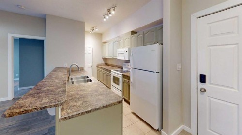 304-290 Plamondon Drive, Fort Mcmurray, AB - Indoor Photo Showing Kitchen With Double Sink