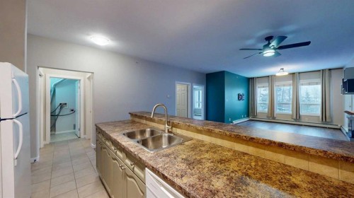 304-290 Plamondon Drive, Fort Mcmurray, AB - Indoor Photo Showing Kitchen With Double Sink