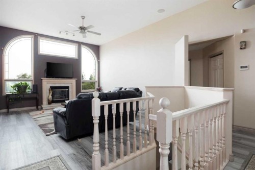 25 Freestone Way, Saprae Creek, AB - Indoor With Fireplace