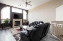 25 Freestone Way, Saprae Creek, AB  - Indoor Photo Showing Living Room With Fireplace 