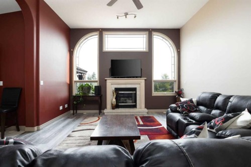 25 Freestone Way, Saprae Creek, AB - Indoor Photo Showing Living Room With Fireplace