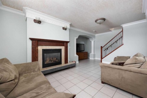 158 Pickles Crescent, Fort Mcmurray, AB - Indoor Photo Showing Living Room With Fireplace