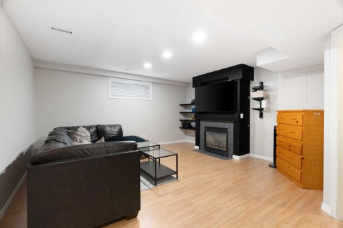 209 Parry Crescent, Fort Mcmurray, AB - Indoor Photo Showing Basement With Fireplace