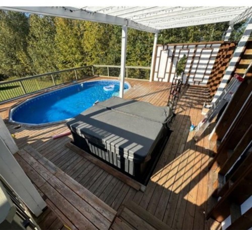 103 Donovan Drive, Anzac, AB - Outdoor With Above Ground Pool