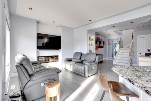 103 Donovan Drive, Anzac, AB - Indoor Photo Showing Living Room With Fireplace