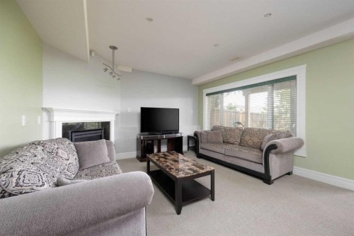 145 Fireweed Crescent, Fort Mcmurray, AB - Indoor Photo Showing Living Room With Fireplace