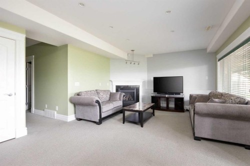 145 Fireweed Crescent, Fort Mcmurray, AB - Indoor Photo Showing Living Room With Fireplace