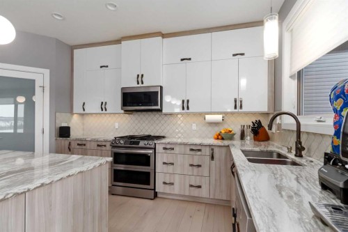 145 Cobblestone Bay, Fort Mcmurray, AB - Indoor Photo Showing Kitchen With Double Sink With Upgraded Kitchen