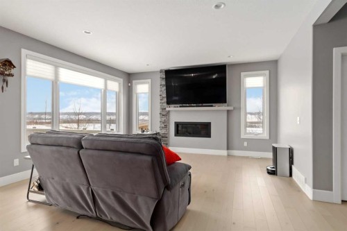 145 Cobblestone Bay, Fort Mcmurray, AB - Indoor Photo Showing Living Room With Fireplace