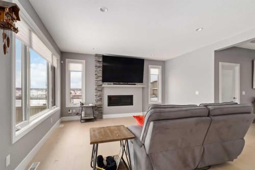 145 Cobblestone Bay, Fort Mcmurray, AB - Indoor Photo Showing Living Room With Fireplace