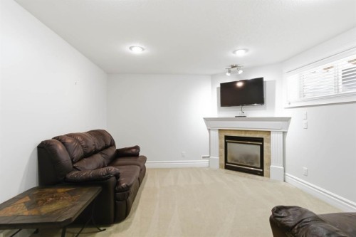 157 Mayflower Crescent, Fort Mcmurray, AB - Indoor Photo Showing Living Room With Fireplace