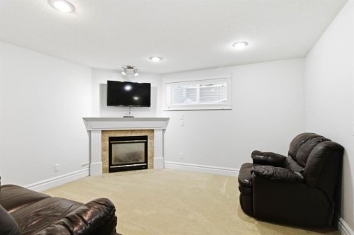 157 Mayflower Crescent, Fort Mcmurray, AB - Indoor Photo Showing Living Room With Fireplace