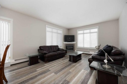 407-100 Denholm Gate, Fort Mcmurray, AB - Indoor Photo Showing Living Room With Fireplace