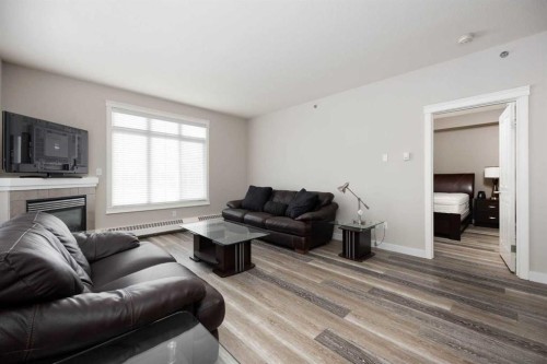407-100 Denholm Gate, Fort Mcmurray, AB - Indoor Photo Showing Living Room With Fireplace