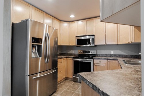 100 Honeysuckle Way, Fort Mcmurray, AB - Indoor Photo Showing Kitchen With Double Sink