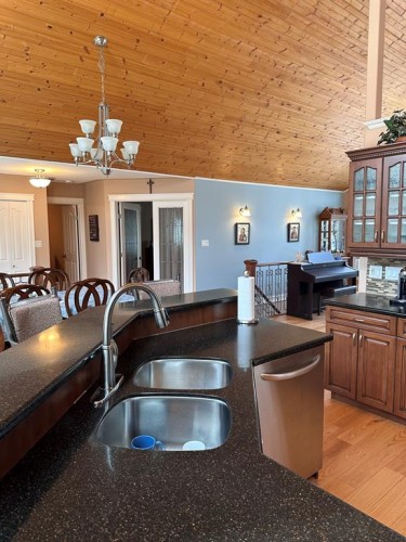 134, 15474 Old Trail, Lac La Biche, AB - Indoor Photo Showing Kitchen With Double Sink