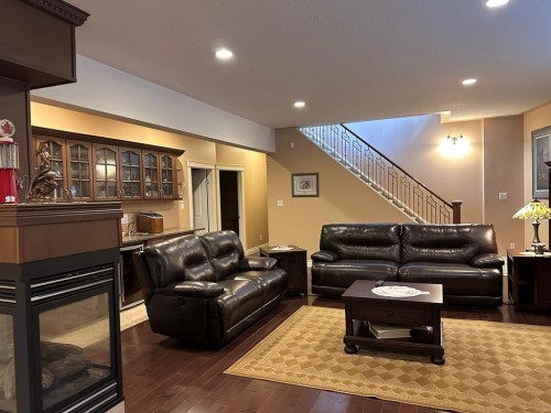 134, 15474 Old Trail, Lac La Biche, AB - Indoor Photo Showing Living Room With Fireplace