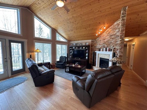 134, 15474 Old Trail, Lac La Biche, AB - Indoor Photo Showing Living Room With Fireplace