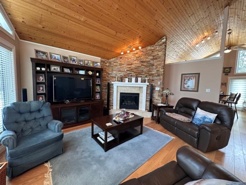 134, 15474 Old Trail, Lac La Biche, AB - Indoor Photo Showing Living Room With Fireplace