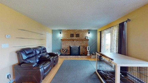 185 Oaks Bay, Fort Mcmurray, AB - Indoor Photo Showing Living Room With Fireplace