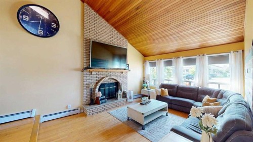 185 Oaks Bay, Fort Mcmurray, AB - Indoor Photo Showing Living Room With Fireplace