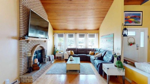 185 Oaks Bay, Fort Mcmurray, AB - Indoor Photo Showing Living Room With Fireplace
