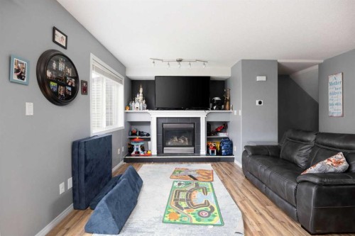7-220 Swanson Crescent, Fort Mcmurray, AB - Indoor Photo Showing Living Room With Fireplace