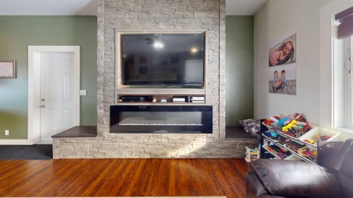 101 68134, Plamondon, AB - Indoor Photo Showing Living Room With Fireplace