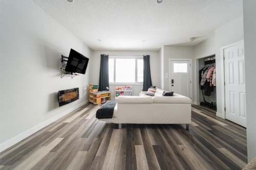 224 Warren Way, Fort Mcmurray, AB - Indoor Photo Showing Living Room With Fireplace
