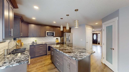 101 Ryan Lane, Fort Mcmurray, AB - Indoor Photo Showing Kitchen With Stainless Steel Kitchen With Double Sink With Upgraded Kitchen