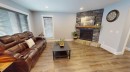 101 Ryan Lane, Fort Mcmurray, AB  - Indoor Photo Showing Living Room With Fireplace 