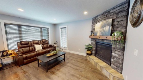 101 Ryan Lane, Fort Mcmurray, AB - Indoor Photo Showing Living Room With Fireplace