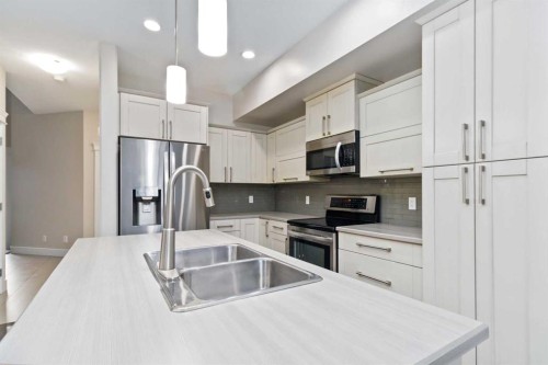 165 Collicott Drive, Fort Mcmurray, AB - Indoor Photo Showing Kitchen With Stainless Steel Kitchen With Double Sink With Upgraded Kitchen