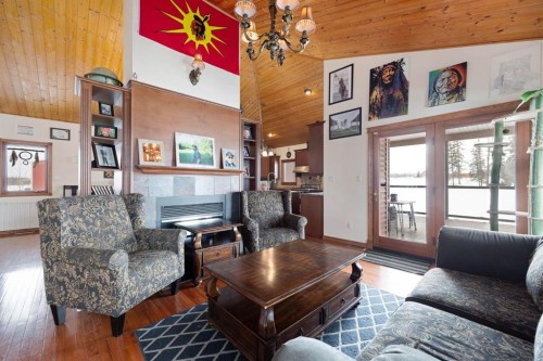 200 Weiss Drive, Saprae Creek, AB - Indoor Photo Showing Living Room With Fireplace